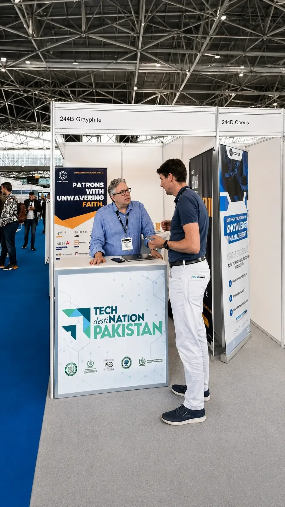 Grayphite team meeting a visitor at booth 244B during AI & Big Data Expo Europe 2023