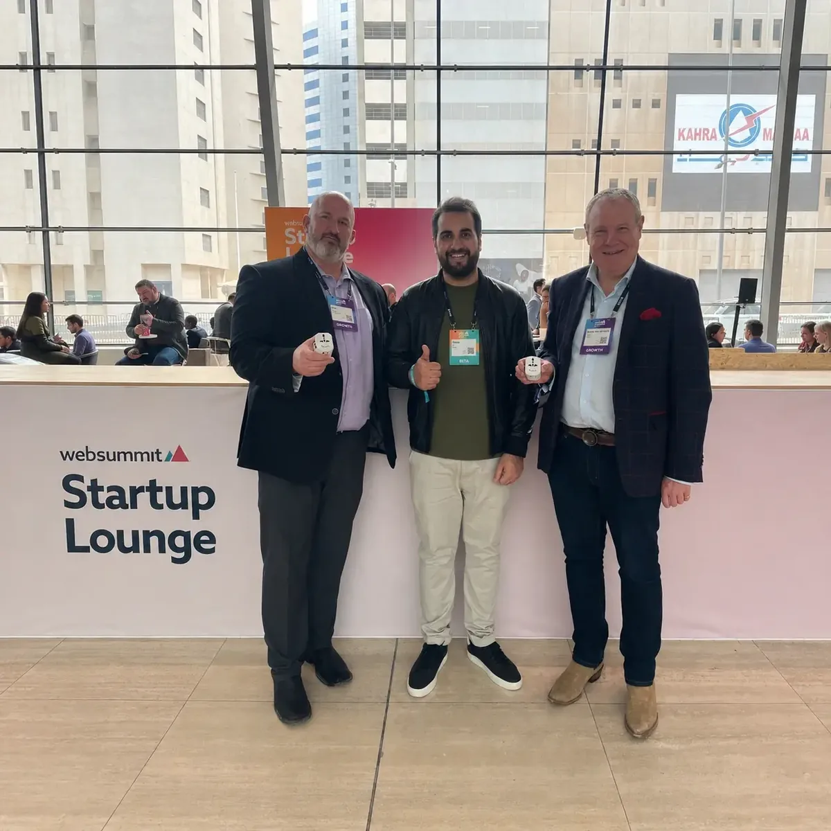 Grayphite team member meeting attendees at Web Summit Qatar